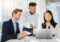 Business team collaborating using ExperienceBUILDER™ AI learning technology
