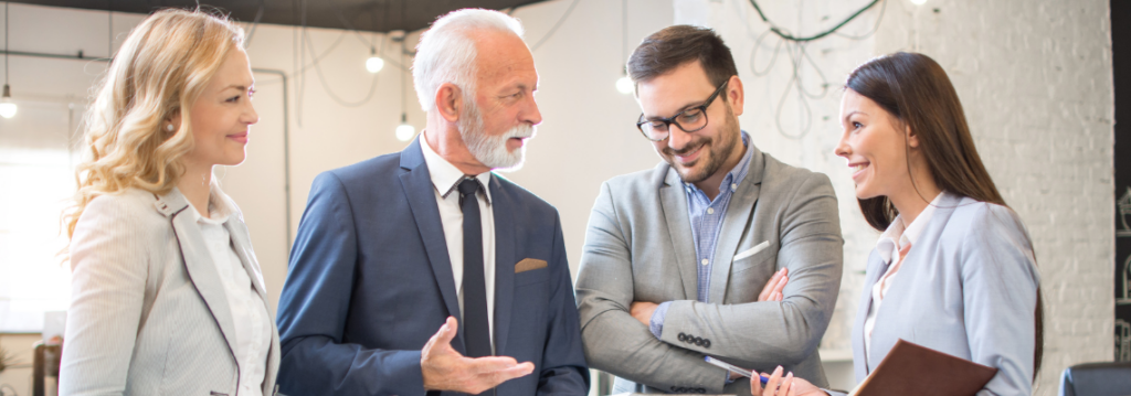 business team of four discussing work